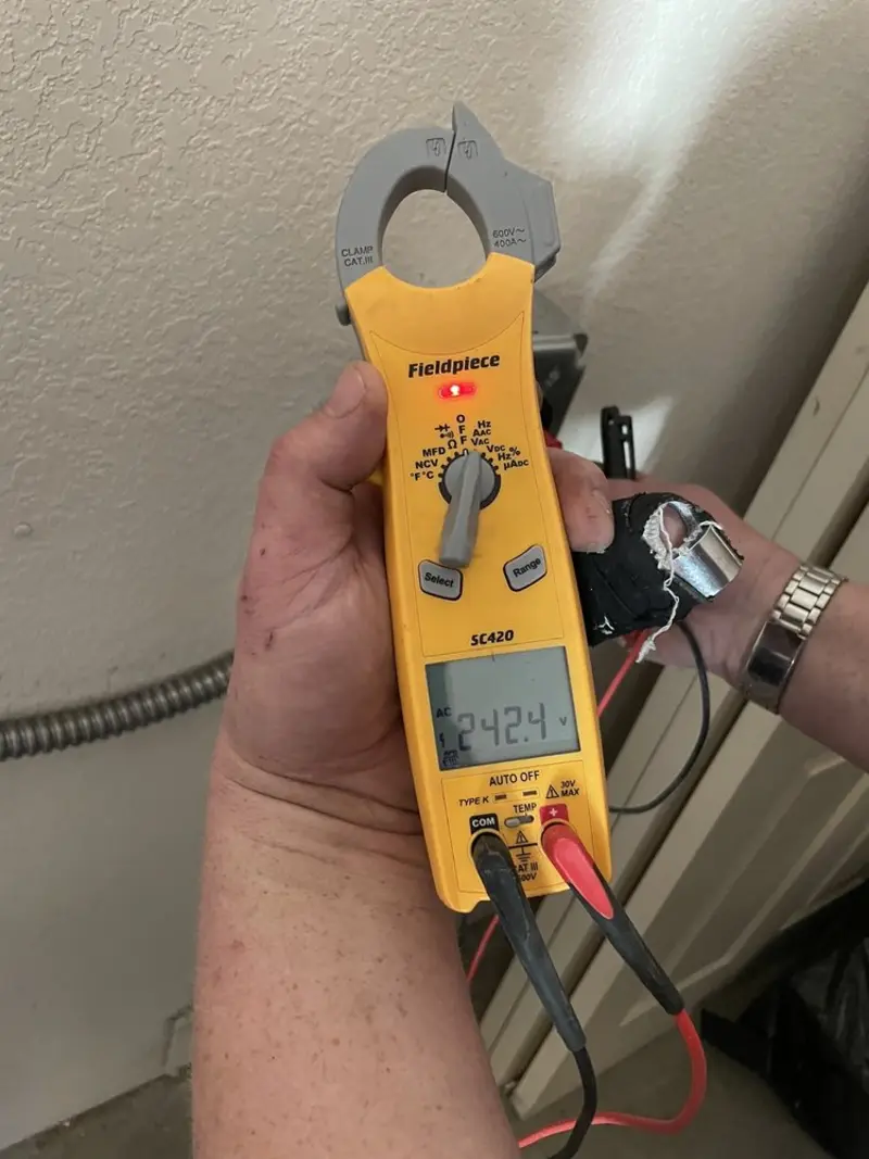 Voltage testing with clamp meter during Recessed Lighting Installation in College Park